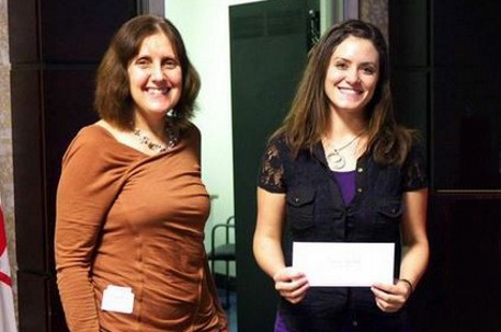 Presentation of the WAMIC scholarship award to Jennifer Blanchard (R), Masters student, by Luise Sander (L).