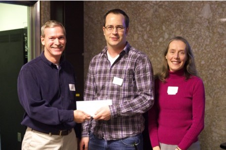 Presentation of the CGG Airborne Geophysics scholarship award to Michael Cunningham, MSc student (Centre) by Davin Allen, CGG (L) and Prof. Claire Samson (R).