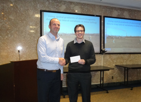 David Allan of Fugro presents the Fugro scholarship to Michal Kolaj.