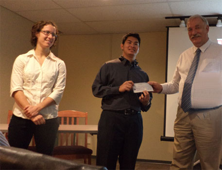 UBC scholarship recipients Tess Baker and Hakim Shukri with Peter Kowlaczyk, Dir.