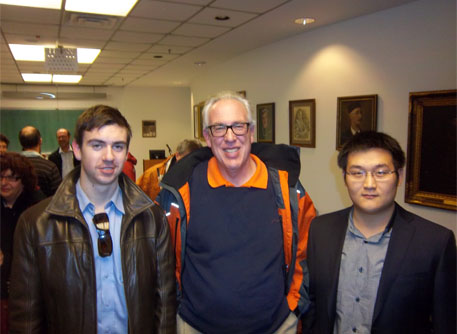Professor Tony Endres with scholarship recipients Phillip Van-Lane and Dong Shi.