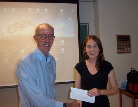 Jerry Roth presents scholarship to Laura Quigley at KEGS meeting.