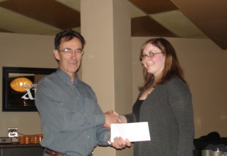 Christine Shiels (University of Saskatchewan) receiving her scholarship cheque from Prof. Jim Merriam.