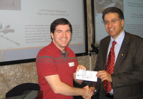 Ray Caron, MSc student at Carleton, receiving KEGS Foundation Fugro scholarship award from George Nader